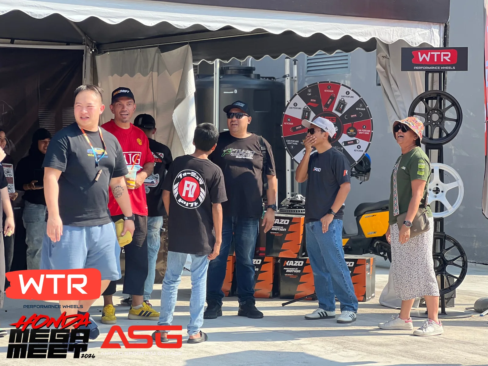 Visitors gathering at the ASG and WTR performance wheels event booth
